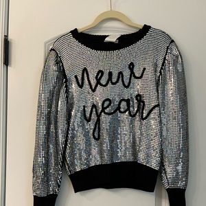 Brand new never work sparkle city sweater. Size small.